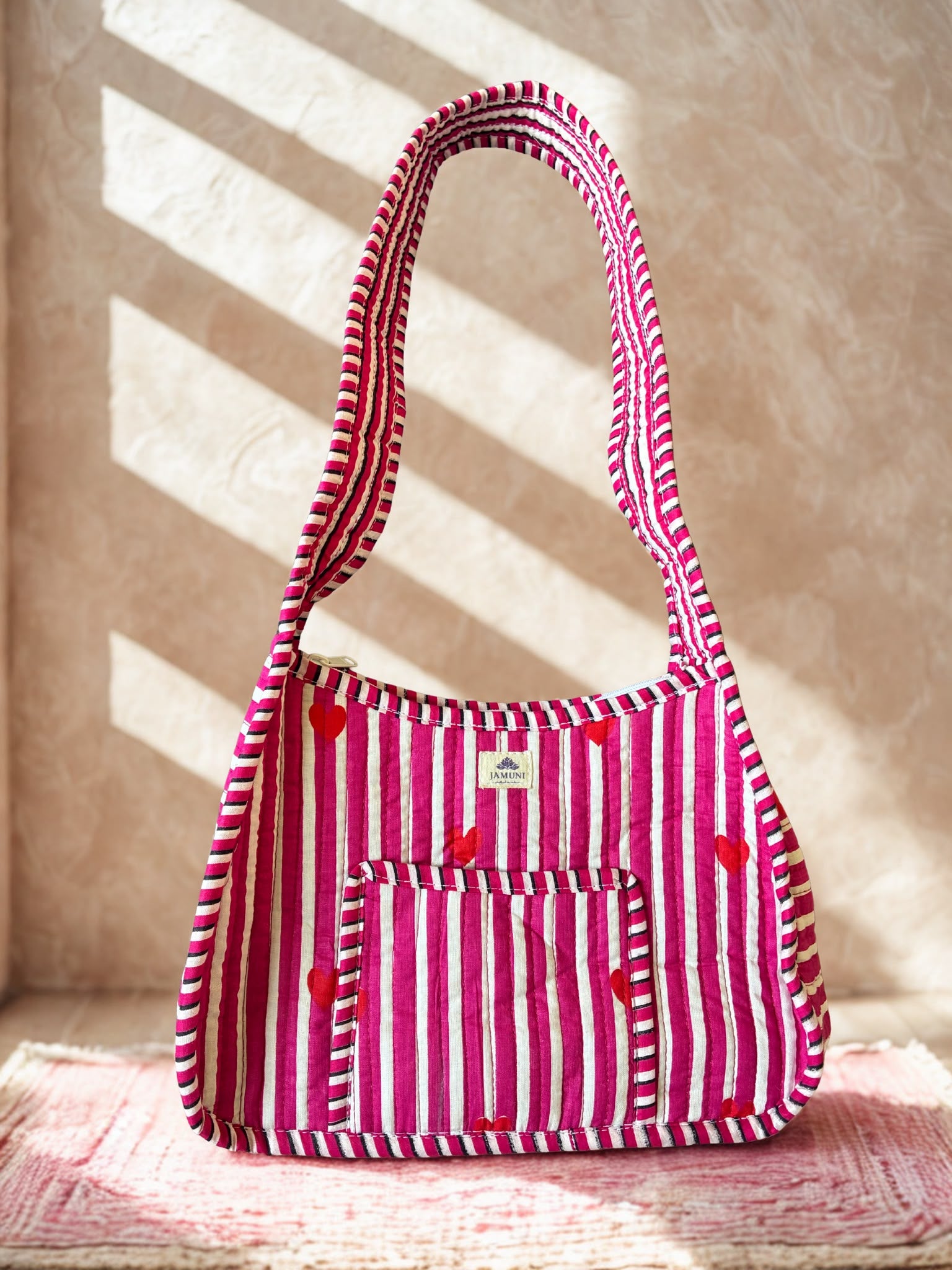 Pink Heart Quilted Cotton Shoulder Bag - hanging on wall showing full strap